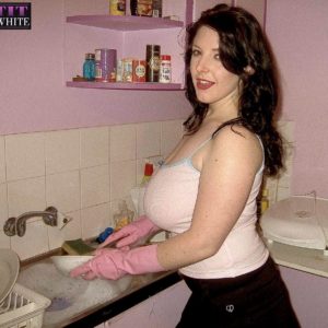Dark haired MILF Angela Milky modeling non naked in micro-skirt and in bathroom and kitchen