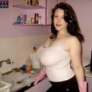 Dark haired MILF Angela Milky modeling non naked in micro-skirt and in bathroom and kitchen