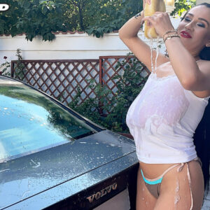 Spindly dark-haired chick Helen Star pulls out her hefty boobs while getting wet during a car washing session