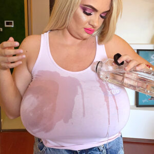 Bootless blonde Kitty Nice covers her huge titties with water and grease during solo action