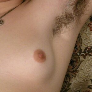 First timer with pierced nipples displays her hairy underarms and beaver