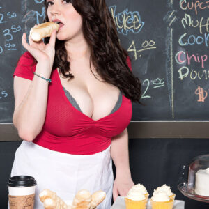 Dark haired girl Kate Marie unveils her enormous titties while stripping nude in a coffee shop