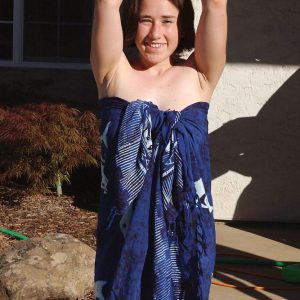 Dark haired girls show their hairy underarms and beavers in a backyard