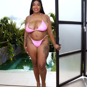 Thick Latina chick Thayana lubricates her boobies after peeling off her bikini top